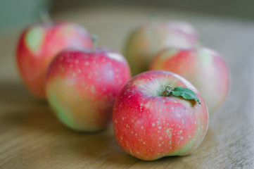 Autumn harvest of red apples on the table.