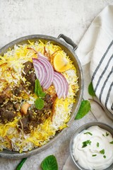 Homemade Beef Biryani served with Raita yogurt dip, overhead view