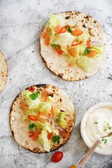 Vegetarian soft tacos served with sour cream dip