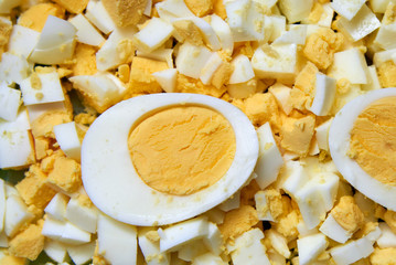 Boiled egg cut in half and also sliced egg