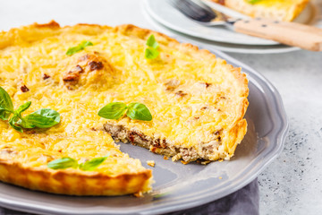 Homemade tuna pie with tomatoes and basil.