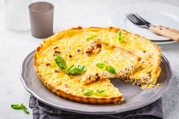 Homemade tuna pie with tomatoes and basil.
