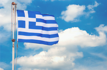 Flag of Greece against an overcast sky
