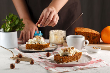 carrot fruit cake. Girl decorates carrot cake.
