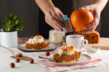 carrot fruit cake. Girl decorates carrot cake.