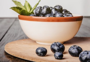 Healthy fruit, strawberry, blueberry, sweet cherry on wooden whi