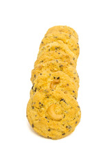 butter cookies with cashew nuts at eye level. isolated on white background