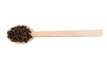 cloves on wooden spoon isolated on white background