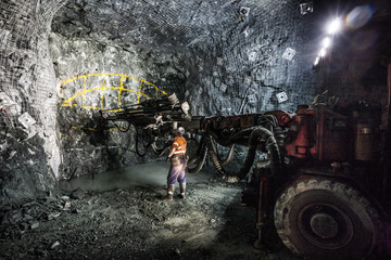 Drilling to place explosives at an underground tunnel at a copper mine in NSW Australia