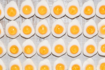 candy fried eggs shaped background