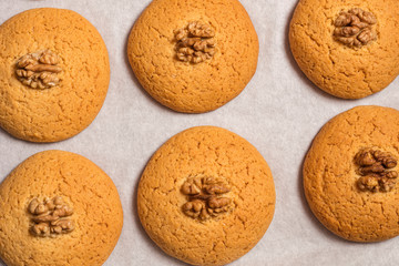 Crispy walnut biscuits. Warm homemade cookies with sugar. view from above