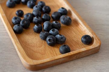 blueberries on wooden board