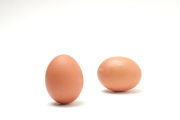 Many eggs on a white scene