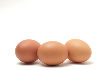 Many eggs on a white scene