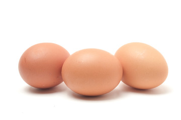 Many eggs on a white scene