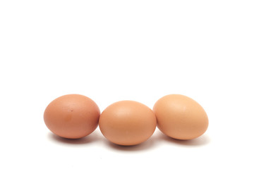Many eggs on a white scene