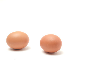 Many eggs on a white scene