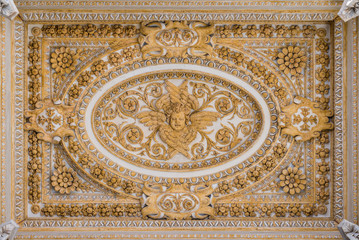 Stucco decoration in the ceiling of the portico in Saint Peter Basilica in Rome, Italy.