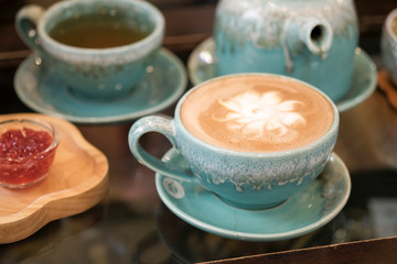 Hot coffee is placed on the table.