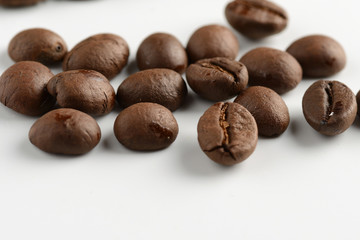 coffee grains on a white background, close-up, coffee roasting