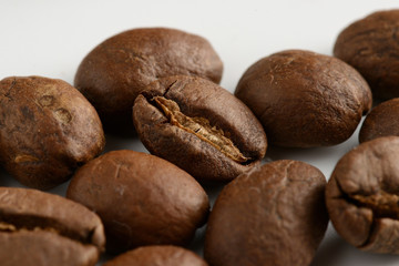 coffee grains on a white background, close-up, coffee roasting