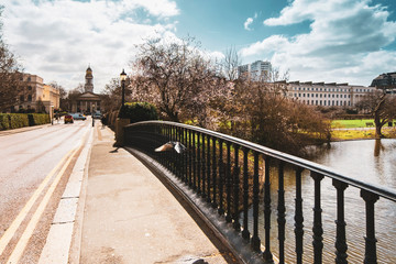 Fototapeta na wymiar Spring scene on York Bridge in Regent's Park with a view towards Saint Marylebone church