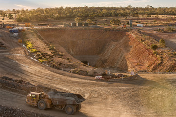 Truck laden with ore leaving a mine tunnel at a copper mine in NSW, Australia