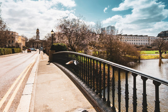 Spring scene on York Bridge in Regent's Park with a view towards Saint Marylebone church