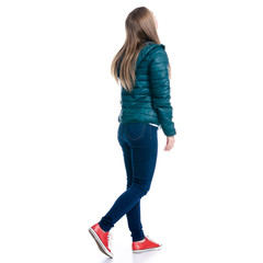 Woman in jeans and jacket walking goes looking on white background. Isolation, back view