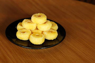 Fried donut with sugar, popular sweet  sold in market or restaurant, high calories, sugar and cholesterol level cause of many chronic disease such as diabetes and heart disease affect economic problem
