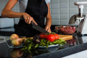 Woman cooking the meat
