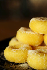 Fried donut with sugar, popular sweet  sold in market or restaurant, high calories, sugar and cholesterol level cause of many chronic disease such as diabetes and heart disease affect economic problem