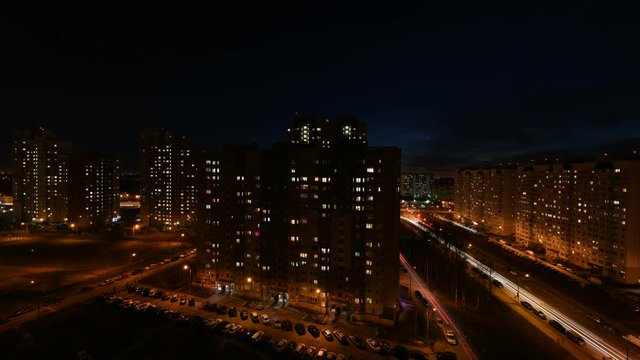 Timelapse of darkening the sky after the sunset and turning the city light on