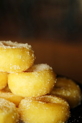 Fried donut with sugar, popular sweet  sold in market or restaurant, high calories, sugar and cholesterol level cause of many chronic disease such as diabetes and heart disease affect economic problem