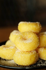 Fried donut with sugar, popular sweet  sold in market or restaurant, high calories, sugar and cholesterol level cause of many chronic disease such as diabetes and heart disease affect economic problem