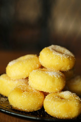 Fried donut with sugar, popular sweet  sold in market or restaurant, high calories, sugar and cholesterol level cause of many chronic disease such as diabetes and heart disease affect economic problem