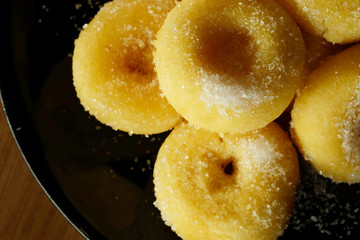 Fried donut with sugar, popular sweet  sold in market or restaurant, high calories, sugar and cholesterol level cause of many chronic disease such as diabetes and heart disease affect economic problem