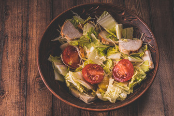 Vegetables in a salad, vegetable salad with Turkey. Cabbage and red tomatoes. Concept: healthy and low-calorie feeding. Diet products