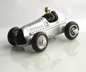 vintage racing car toy silver color over white background