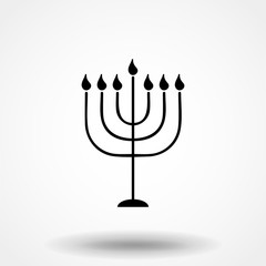 Black Menorah with burning candles is isolated on the white background is a flat vector illustration for Hanukkah. The concept is Religion icon.
