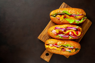 homemade hot dogs on concrete background, slate