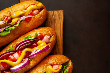 homemade hot dogs on concrete background, slate