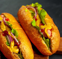 homemade hot dogs on concrete background, slate