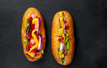 homemade hot dogs on concrete background, slate