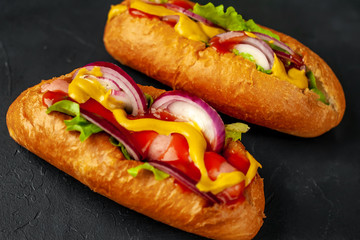 homemade hot dogs on concrete background, slate