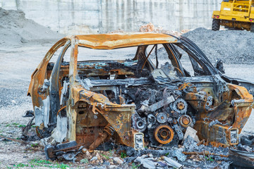 Fototapeta premium Close-up passenger car involved in accident on the road and burned after crash