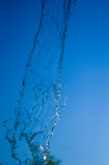 Obraz na płótnie Canvas transparent falling water vertical flows, close up