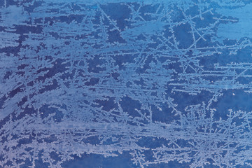 Frosty patterns on glass, background.