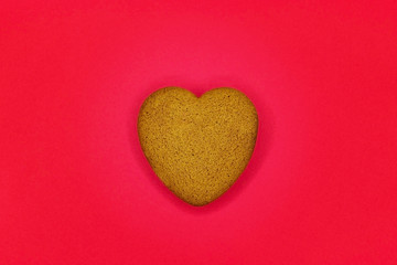 Valentine's day cookies on stand against wooden background