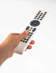 hand holding a remote control on white background, close-up